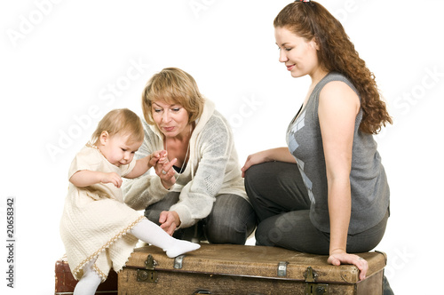Photo: Mature grandmother, young mother and little daughter Mature grandmother, young mother and little daughter