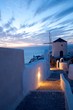 Windmühle in Oia auf Santorin bei Sonnenuntergang Windmühle in Oia auf Santorin bei Sonnenuntergang