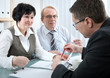 Senior couple meeting with agent or advisor