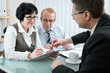Photo: Senior couple meeting with agent or advisor Senior couple meeting with agent or advisor