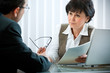 mid-adult man meeting with agent or advisor mid-adult man meeting with agent or advisor