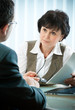 mid-adult man meeting with agent or advisor mid-adult man meeting with agent or advisor