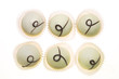 Six white chocolates on a white background