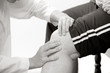 physical therapist checks a knee
