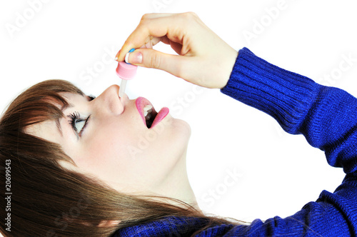 Photo: injecting drops into the nose injecting drops into the nose