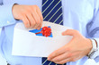 Businessman is sending a pre-approved credit card by mail Businessman is sending a pre-approved credit card by mail