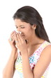 slim girl sneezing with tissue paper
