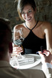 Young woman smiling at young man giving her a ring