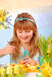 young girl  painting easter eggs