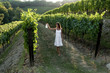 Young woman in vineyard holding lantern