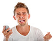 Man with a cell phone crying