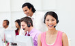 Foto: Portrait of an Asian customer agent and her team Portrait of an Asian customer agent and her team
