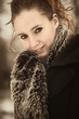 Brownish portrait of beauty in winter coat