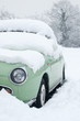 little green car buried in a snowdrift little green car buried in a snowdrift