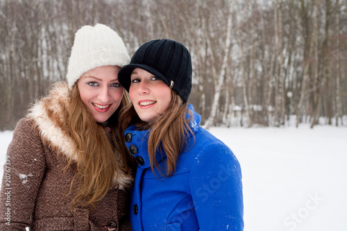 Photo: sisters posing for the camera in winter sisters posing for the camera in winter