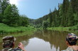 Fishermen float on the river