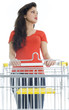 standing young woman with empty shopping cart