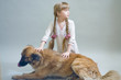 girl in a pajamas with a big dog
