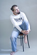 barefoot man in jeans