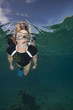 Photo: Fit woman snorkeling underwater Fit woman snorkeling underwater