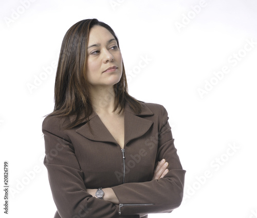 Photo: Arms crossed head turned looking down. Arms crossed head turned looking down.