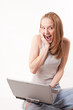 red-haired girl with laptop on white