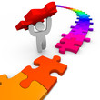 Puzzle - Person Lifts Piece Into Place