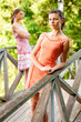 Two young and beautiful girls at banisters