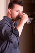 Young man drinking wine