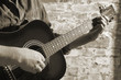 Playing on acoustic guitar