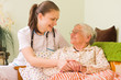 Foto: Helping a sick elderly woman Helping a sick elderly woman