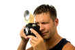 man with old fashioned photo camera over white background