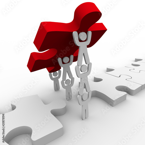 Illustration: Teamwork Placing Final Piece in Puzzle Teamwork Placing Final Piece in Puzzle