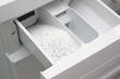 Foto: Washing powder in washing machine Washing powder in washing machine