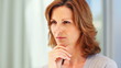 Worried young woman thinking about something stressful