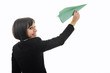 business woman throwing  paper airplane