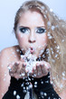girl blowing snow