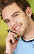 Photo: casual man talking on his phone casual man talking on his phone