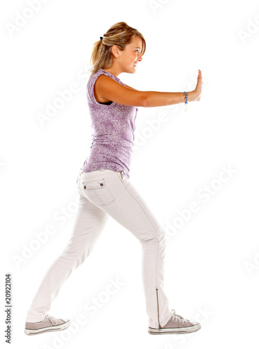Photo: Woman pushing something Woman pushing something