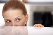 Photo: blonde spying over a table blonde spying over a table