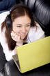girl on a laptop listening to music