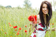 girl running in poppy field