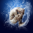 Water drops around men under water on blue background