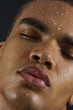 Face of man with water drops