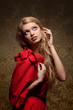 Portrait of beautiful glamour young blond woman in red dress