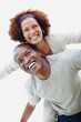 Smiling young couple having fun together against white