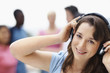 Closeup of a teenager listening to music on headphones on white
