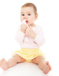 Girl sucking a baby wipe