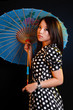 geisha posing isolated on black