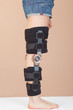 Adjustable support for leg or knee injury